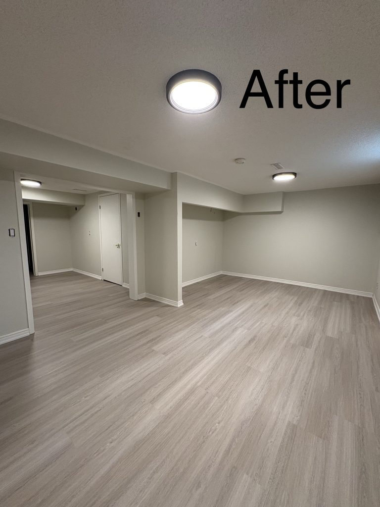 a residential painted room freshly painted with a wood floor and a light fixture